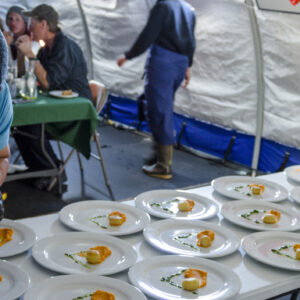 ALE chef, Nestor Suan, plates food for a celebration meal.